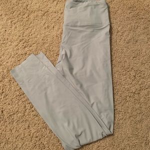 thin, light blue leggings.